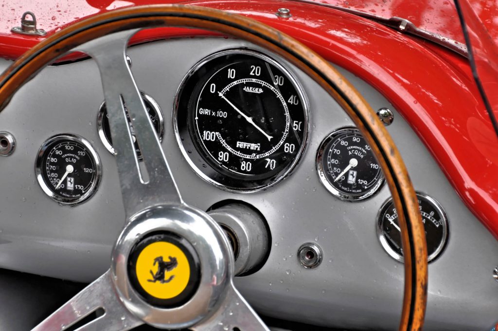 steering wheel of a red luxury car in need of Ferrari repair in Davie FL