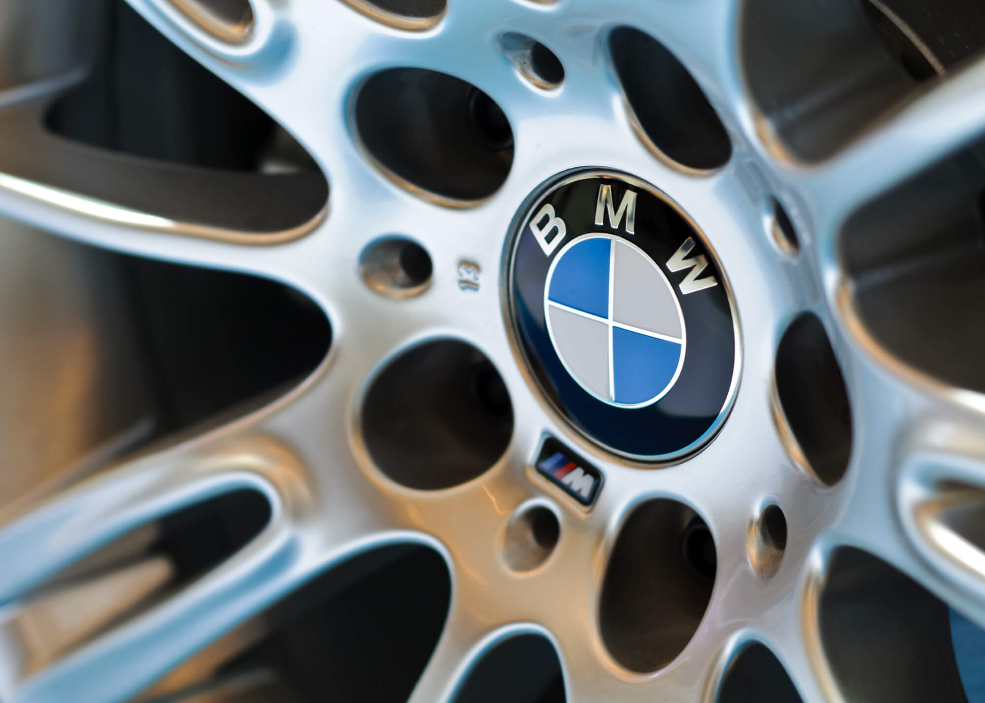 bmw wheel of a car in a BMW performance shop Davie FL